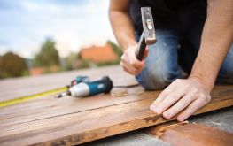 Graphicstock Handyman Installing Wooden Flooring In Patio Working With Hammer B0zhuthhbz